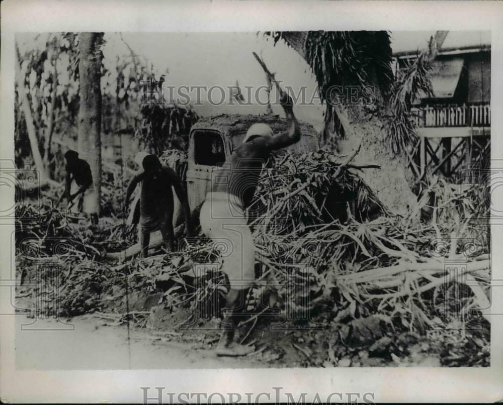 1937 Press Photo Natives of Archipelago New Guinea Clear Away Volcanic Mud