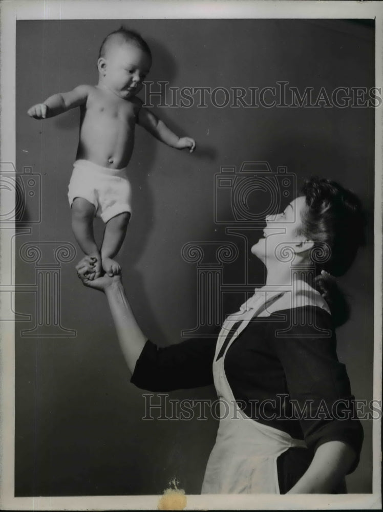 Load image into Gallery viewer, 1944 Press Photo Louis Pethro Son of Pvt &amp; Mrs Louis Pethro Jr Balancing
