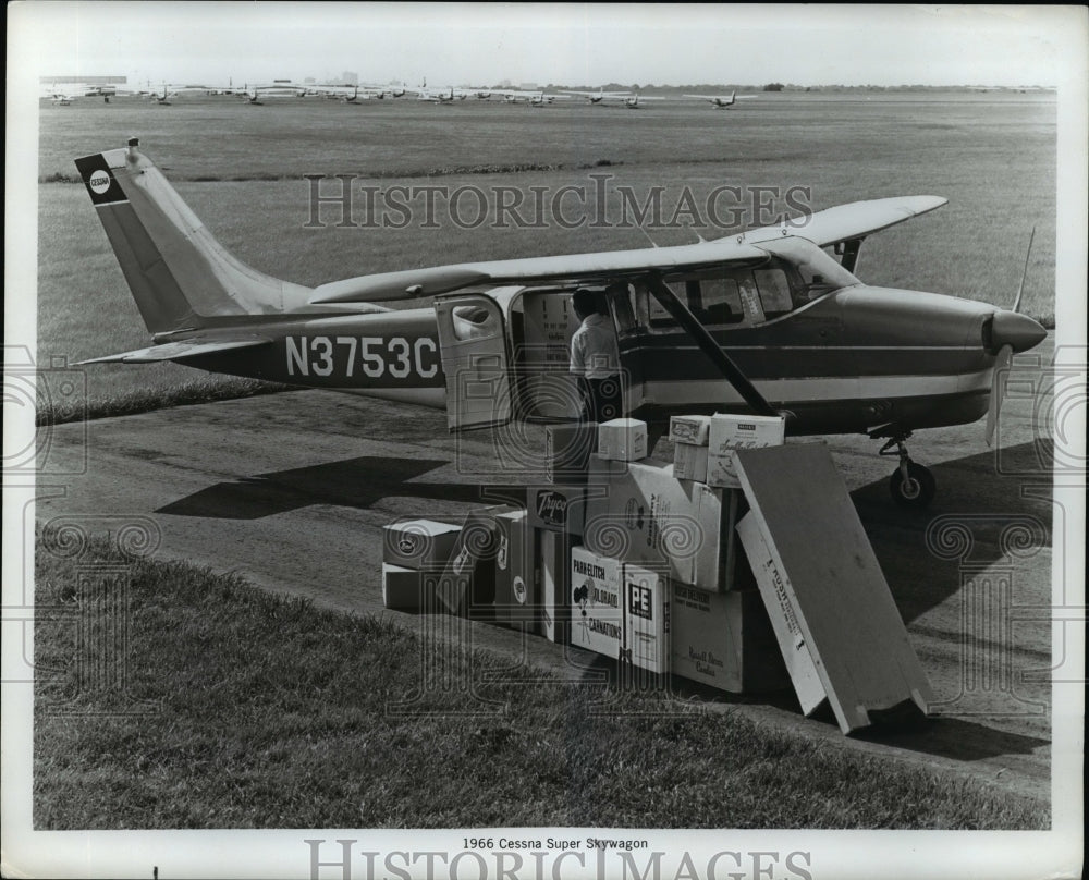 1955 Press Photo Cessna Plane Being Loaded with Packages - nex95880