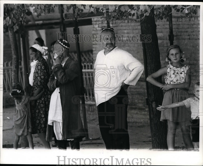 Load image into Gallery viewer, 1964 Press Photo People in Central Asian and Western Dress Skull Cap in Tashkent
