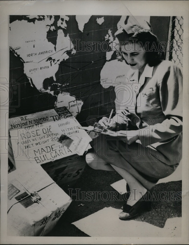 Load image into Gallery viewer, 1945 Press Photo Pauline Meyer with 400 Pounds of Rare Rose Oil for Perfumes
