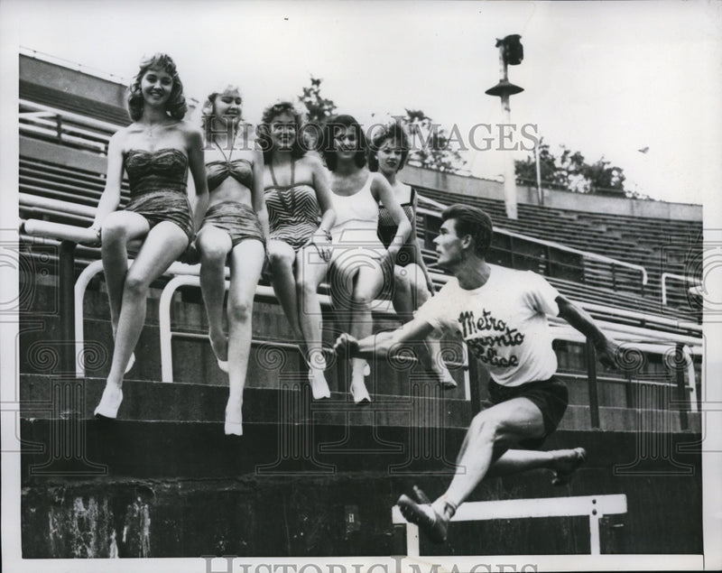 Load image into Gallery viewer, 1960 Press Photo Officer Bill Costello Running Hurdles Police Field Day &amp; Beauty
