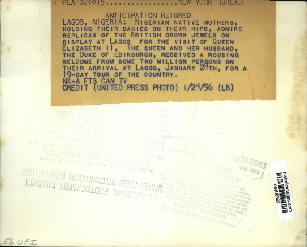 1956 Press Photo Nigerian Native Mothers Hold Both Babies & Crown Jewel Replicas