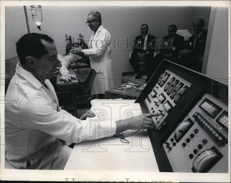Load image into Gallery viewer, 1967 Press Photo Dr. Denson Controlling The Patient Simulator - ney09922
