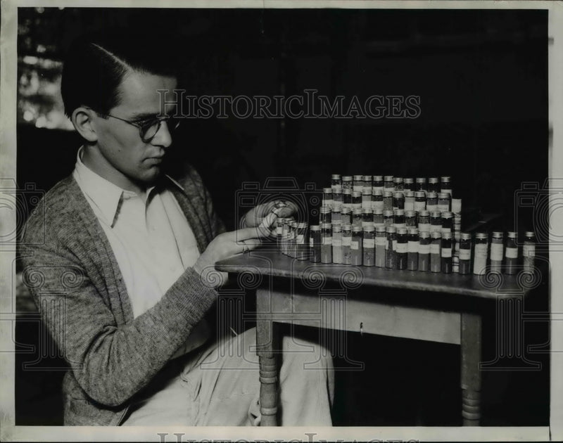 Load image into Gallery viewer, 1935 Press Photo College Student Calvin Roll w Collection of Soil Samples
