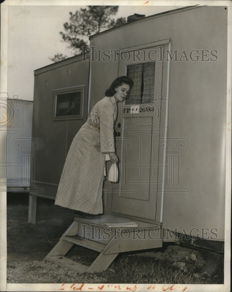 Load image into Gallery viewer, 1945 Press Photo Woman Bringing in Morning Milk &amp; Paper to GI Trailer
