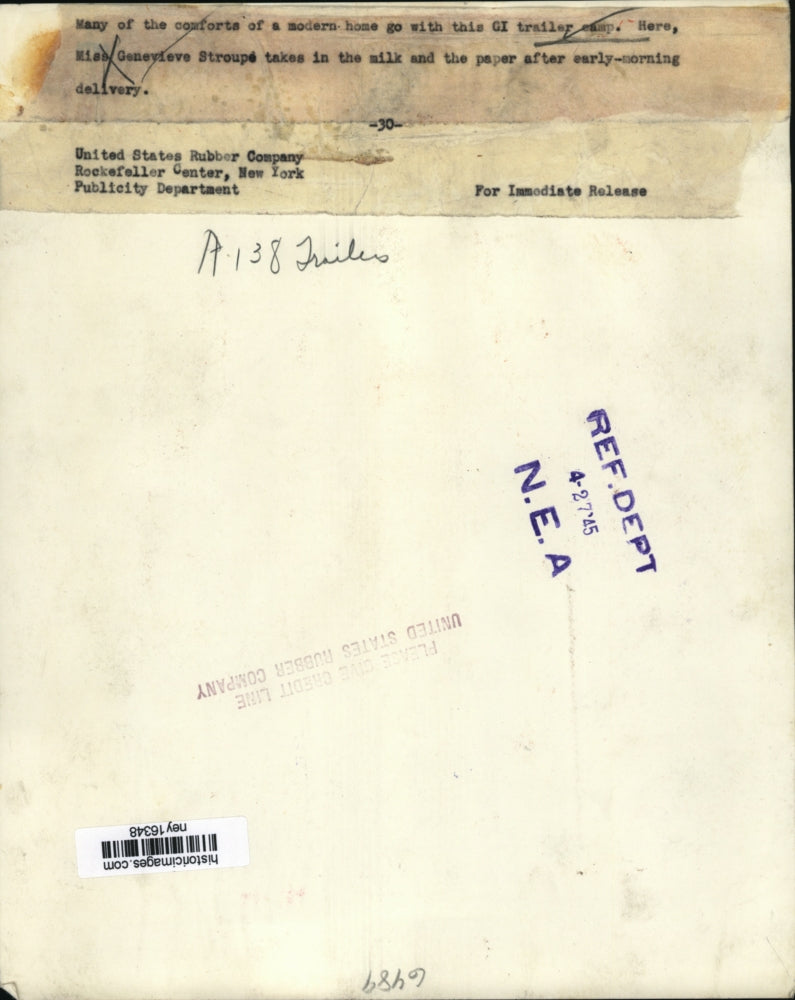 1945 Press Photo Woman Bringing in Morning Milk & Paper to GI Trailer