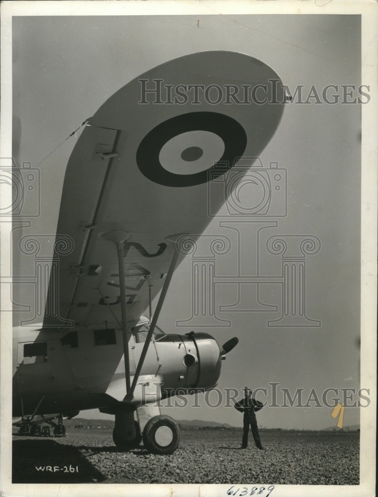 Load image into Gallery viewer, 1941 Press Photo Member of Canada's Air Cadet League surveys a Lysander airplane
