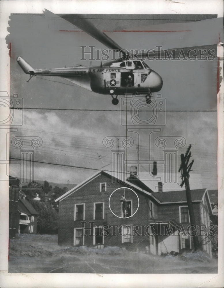1955 Press Photo Helicopter Rescues Man in Flood - ney27674