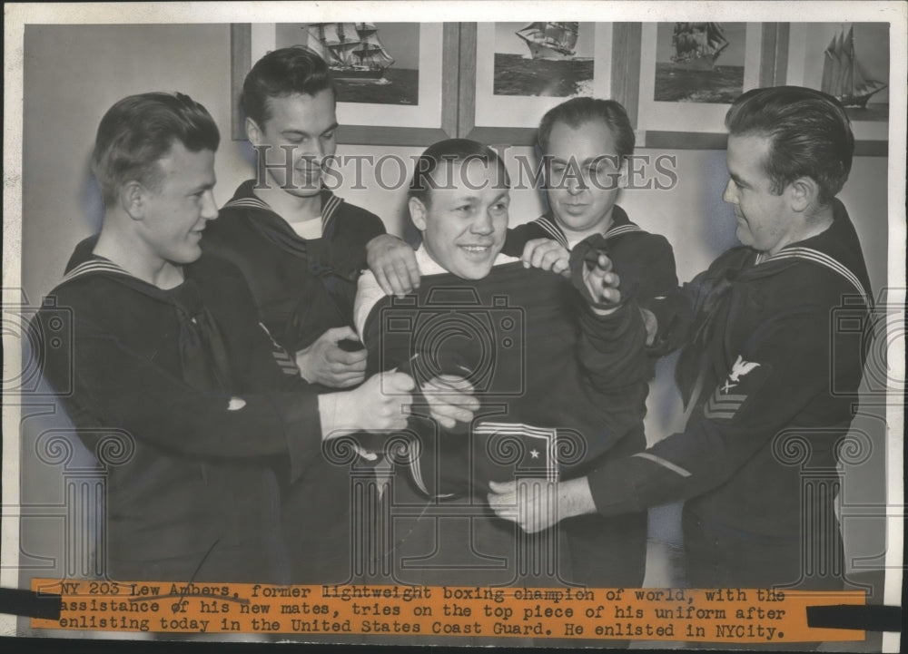 1942 Press Photo Boxer Lew Ambers Tries on His United States Coast Guard Uniform