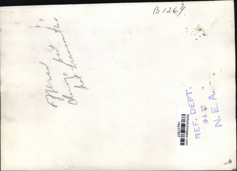 1942 Press Photo Boxer Lew Ambers Tries on His United States Coast Guard Uniform