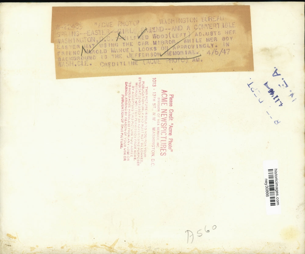 1947 Press Photo Hilfred Wood Adjusts Easter Hat While Riding in Convertible