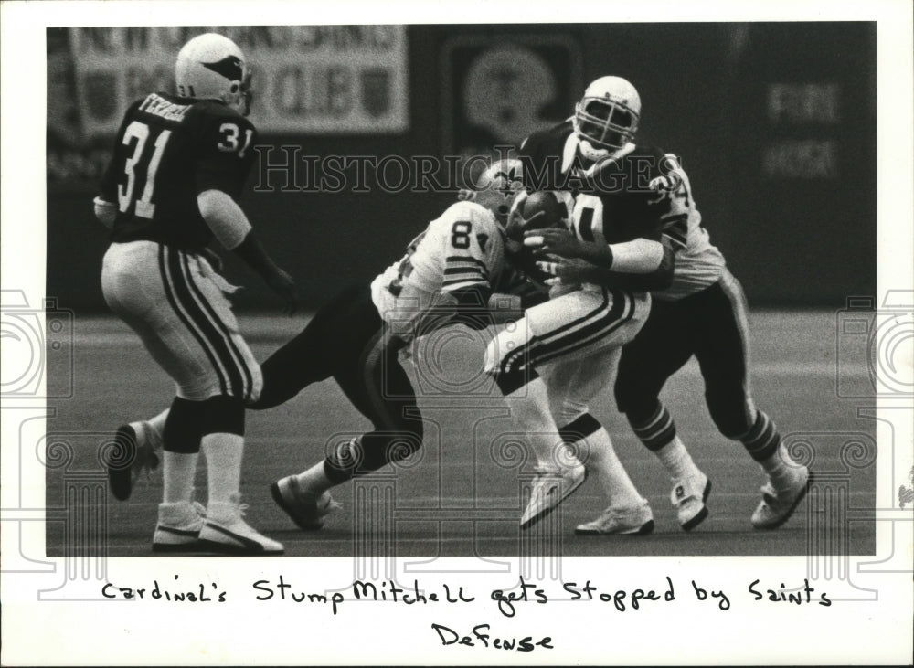 1982 Press Photo New Orleans Saints - Stump Mitchell stopped by Saints defense.- Historic Images