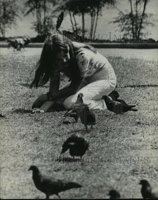 1974 Press Photo Jackson Square - A girl in the grass with pigeons. - noa01565