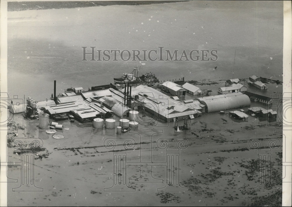 1957 Press Photo Hurricane Audrey-The Menhaden Factory surrounded by flood water- Historic Images