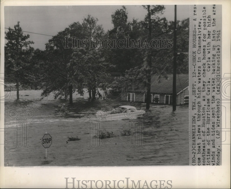 Load image into Gallery viewer, 1961 Press Photo Hurricane Carla- A rescue boat plows through high waters.
