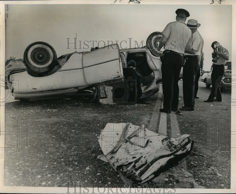 1966 Press Photo Accidents- Administering conditional last rites to John Ellis.- Historic Images