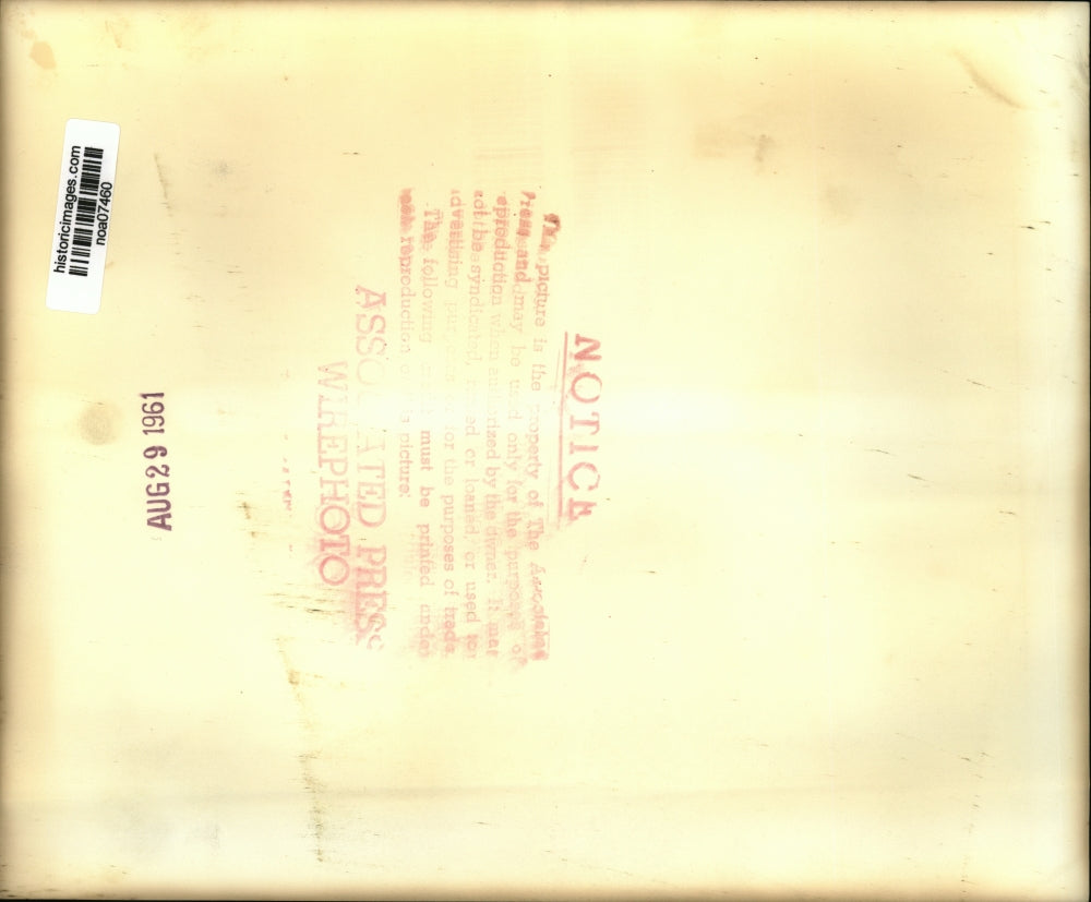 1961 Press Photo Airplane Accidents-Firemen pour water on Navy jet fighter.