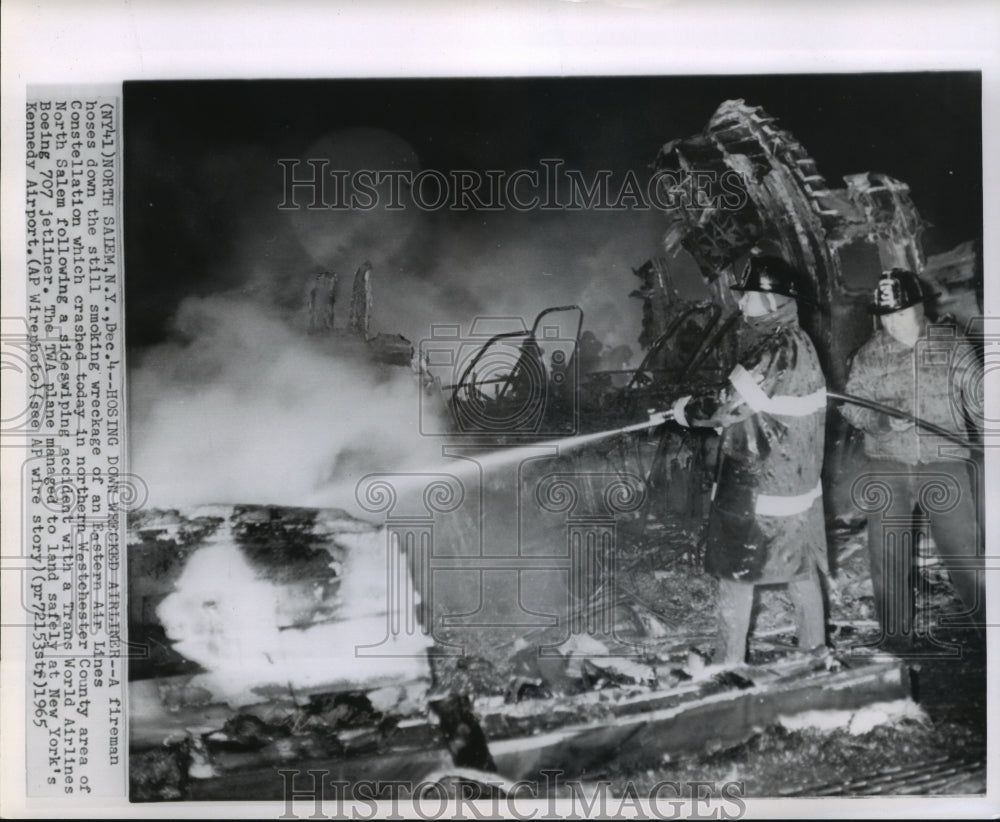 1965 Press Photo Fireman at scene of Easter Air Lines Constellation crash- Historic Images