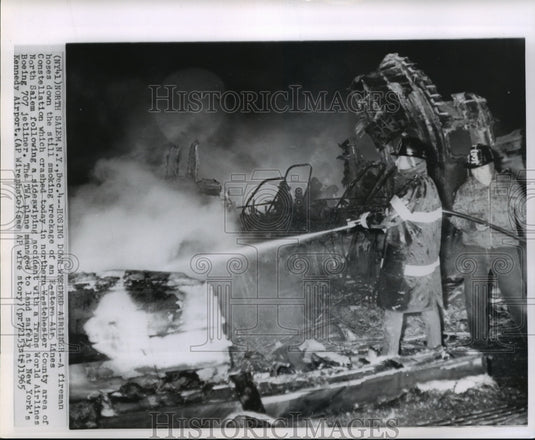 1965 Press Photo Fireman at scene of Easter Air Lines Constellation crash- Historic Images