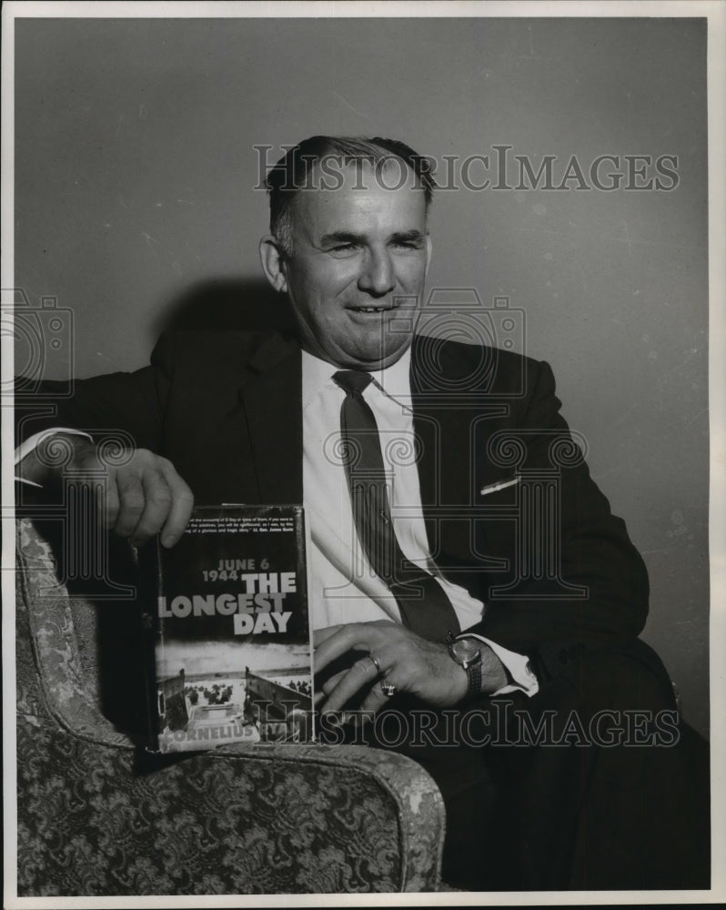 1964 Press Photo Dr. Nick J. Acicardo holding The Longest Day.- Historic Images