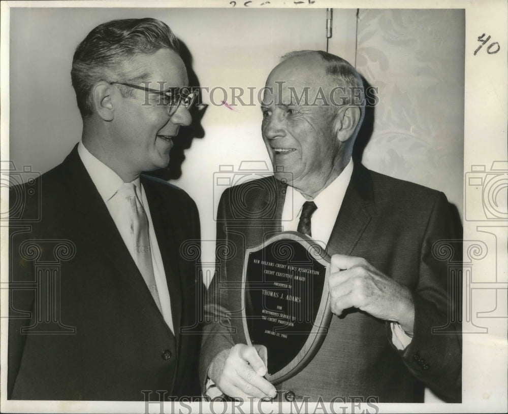 1966 Press Photo Showing the plaque he won as Credit Executive of the Year.- Historic Images