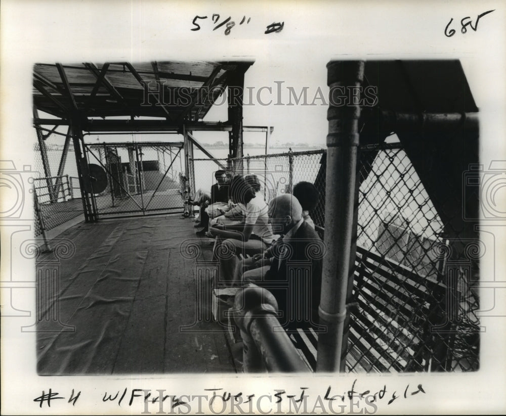 1977 Press Photo Passengers sit silently waiting for the next ferry. - noa12446