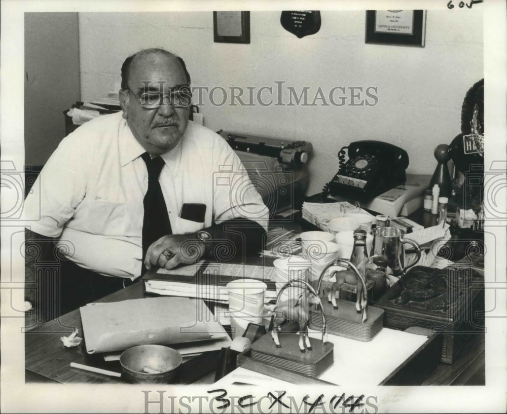 1975 Press Photo Henry Asher Jr. at his Desk at Loyola University - noa17755