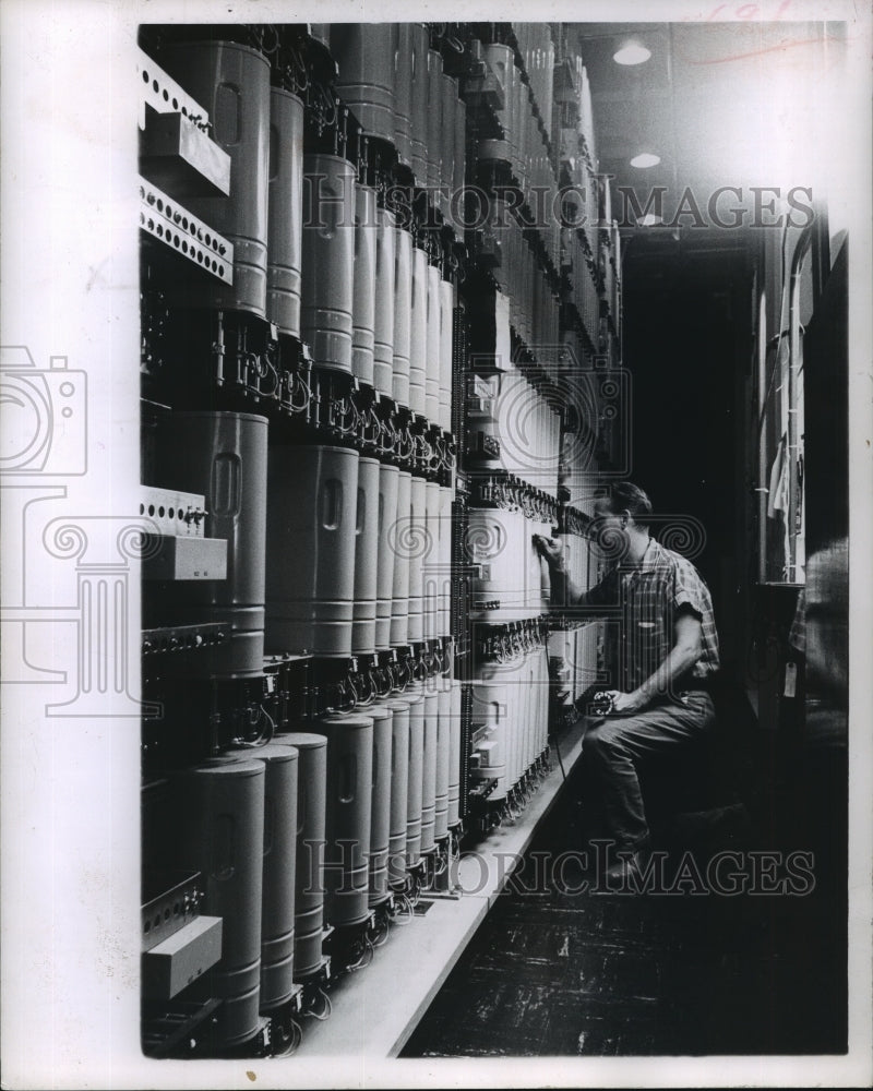 1962 Press Photo Donald Baumann Adjusts Automatic Dial Equipment for Telephones- Historic Images