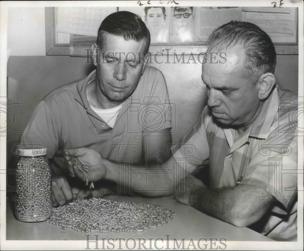 1963 Press Photo Police Officers Robert Barre, Ira Austin Examine&quot;Red Birds&quot;- Historic Images