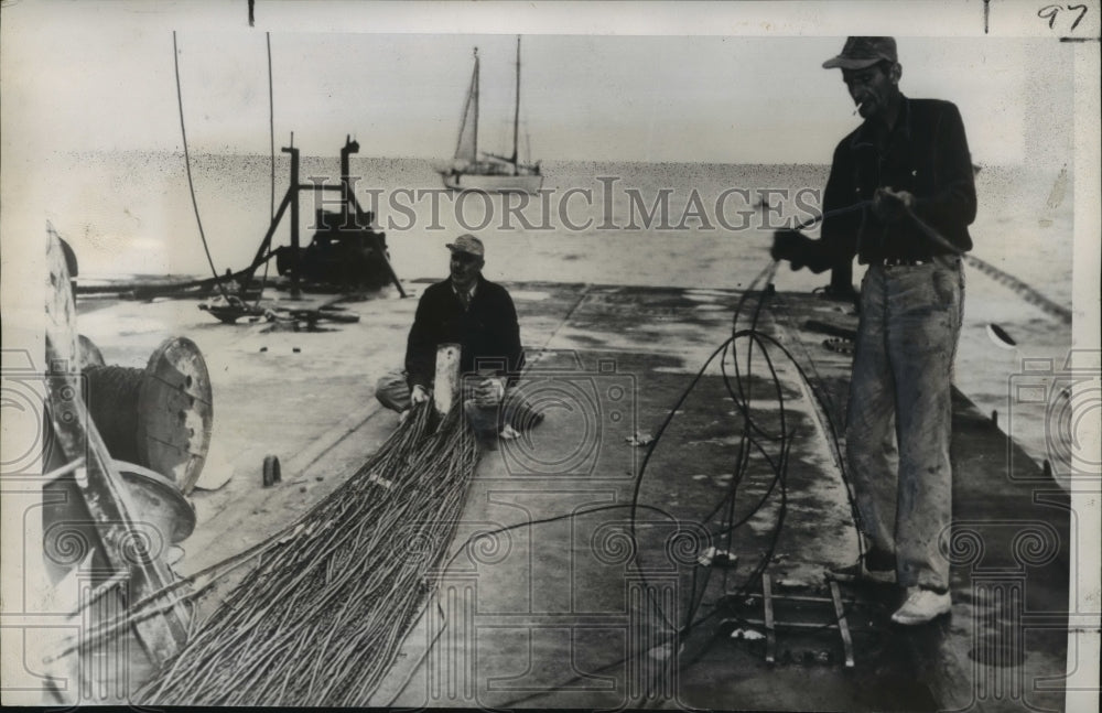 1949 Press Photo Maintenance Men Inspect Miles of Undersea Power Cable- Historic Images