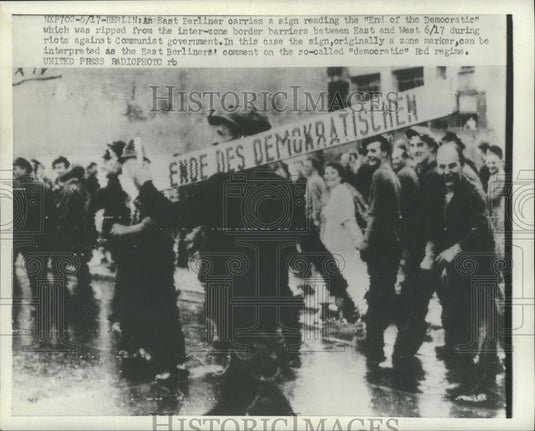 1953 Press Photo East Berliner carries a sign during riot against the Communist- Historic Images