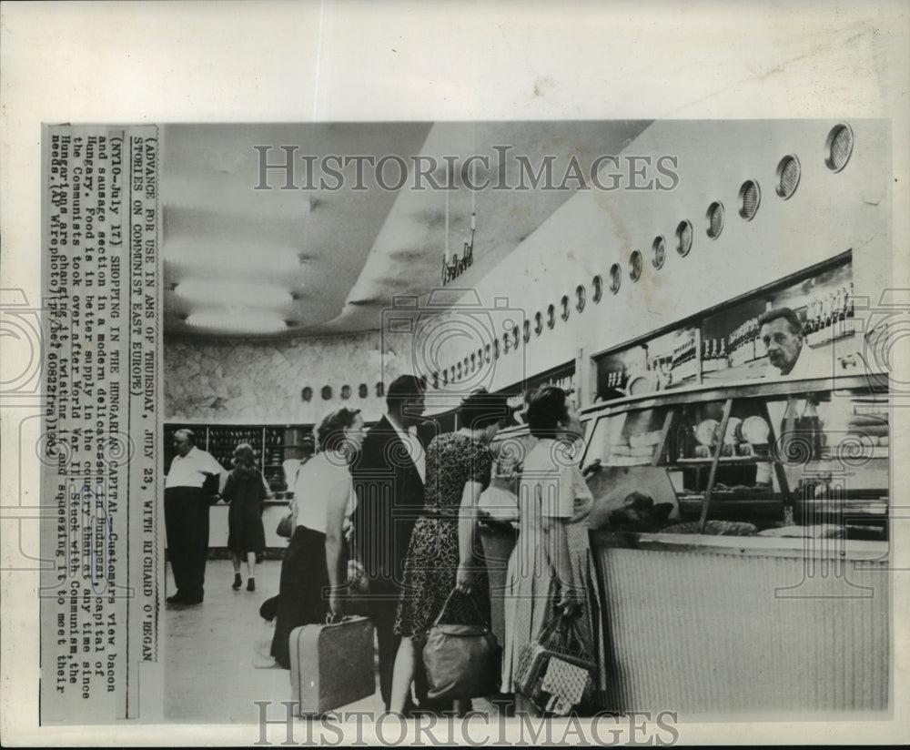 1964 Press Photo Customers view delicatessen meats in Budapest grocery store- Historic Images