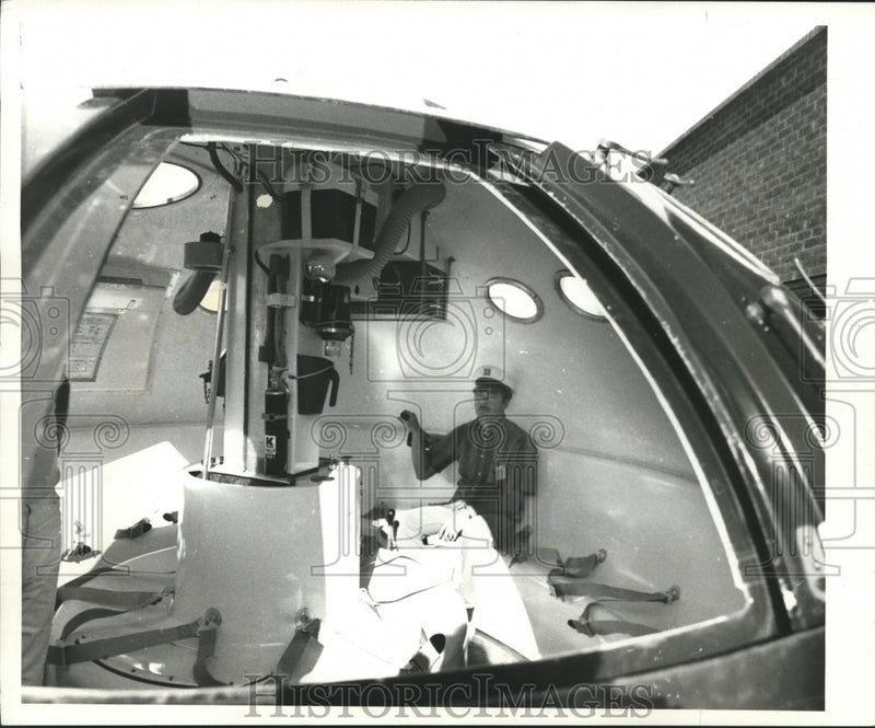 Load image into Gallery viewer, 1968 Press Photo Man sits in unsinkable boat/capsule with room for more people

