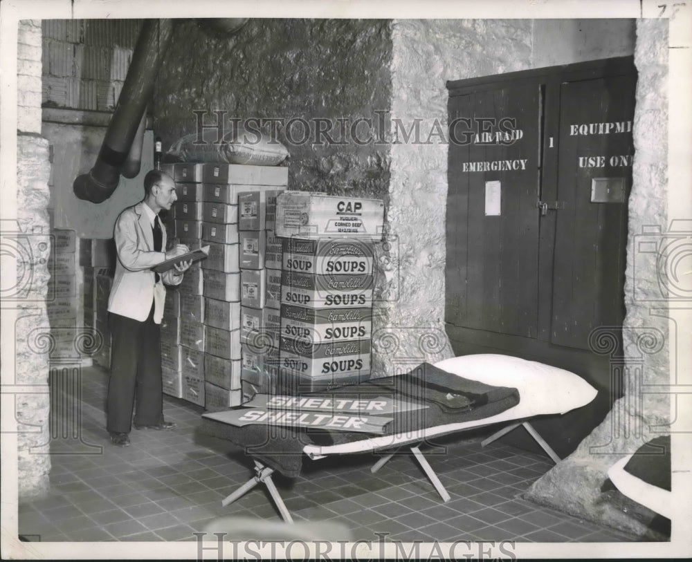 1951 Press Photo Joseph Esposito, library employee checks food inventory