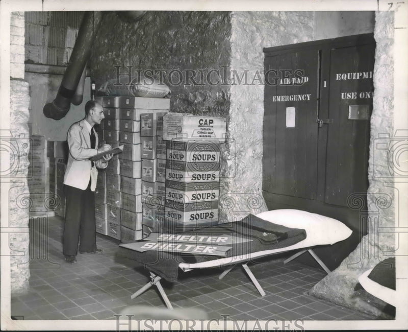 Load image into Gallery viewer, 1951 Press Photo Joseph Esposito, library employee checks food inventory
