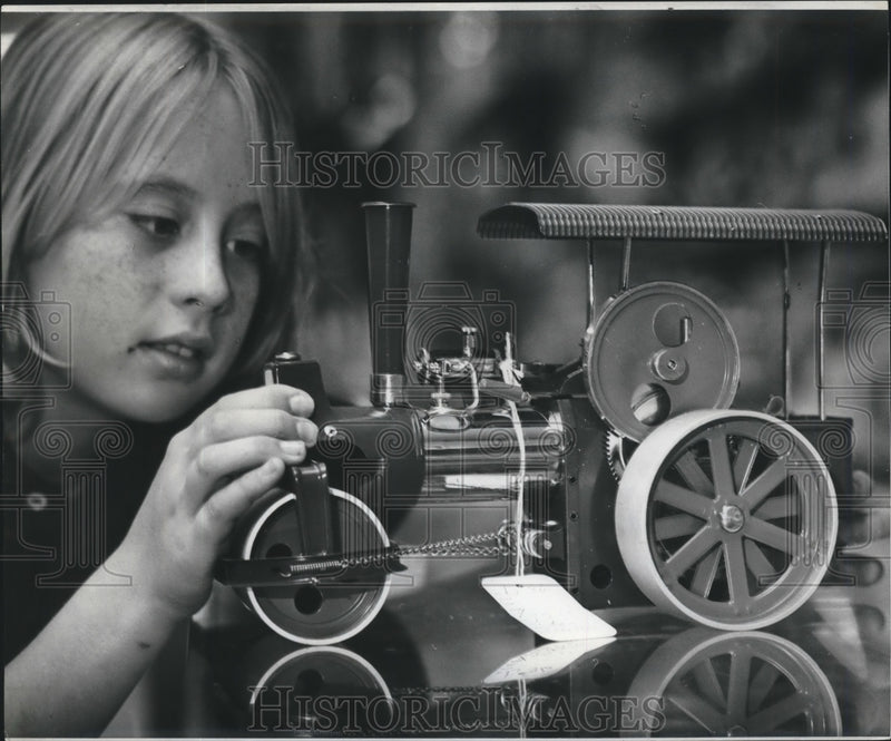 Load image into Gallery viewer, 1974 Press Photo Little Girl play with Train made form Recycled Parts, Christmas
