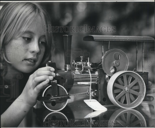 1974 Press Photo Little Girl play with Train made form Recycled Parts, Christmas