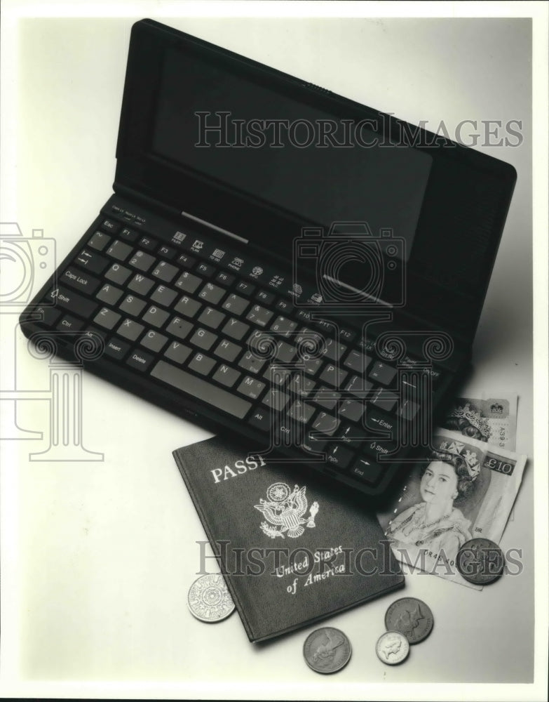  Press Photo Computers getting smaller, this computer is compared to a passport.- Historic Images