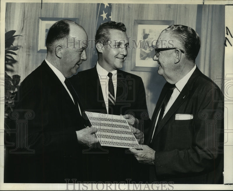 Load image into Gallery viewer, 1967 Press Photo John H. Dalton, Finland, receives sheet of Finland stamps
