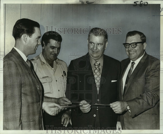1969 Press Photo Police leaders present checks to Children Football Fund members