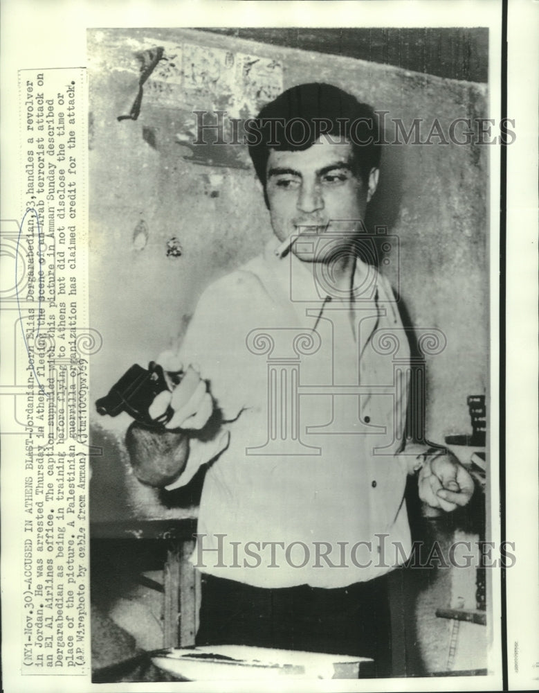 1969 Press Photo Terrorist Elias Dergarabedian trains on handling a gun