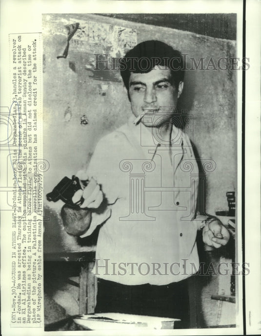 1969 Press Photo Terrorist Elias Dergarabedian trains on handling a gun