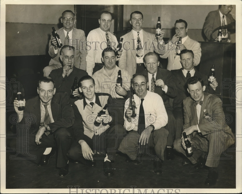 1949 Press Photo Group Poses Holding Drink Bottles - noa88565