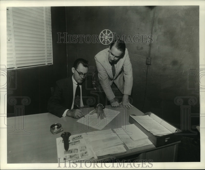 Load image into Gallery viewer, 1954 Press Photo F.J. Didier of Delta Visual and Derek Lawford, British officer.
