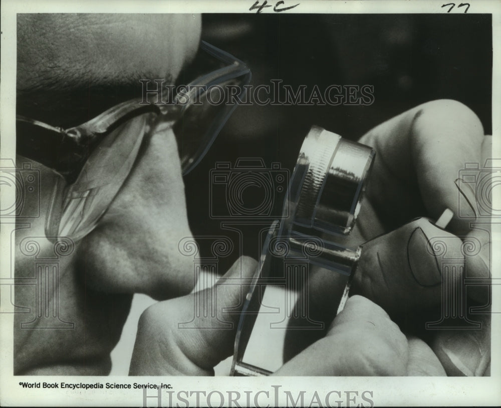 1967 Press Photo Inspector Checks Drug for Defects- Historic Images