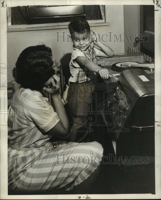 1955 Press Photo Billy Dupre with special earphone that let him hear music
