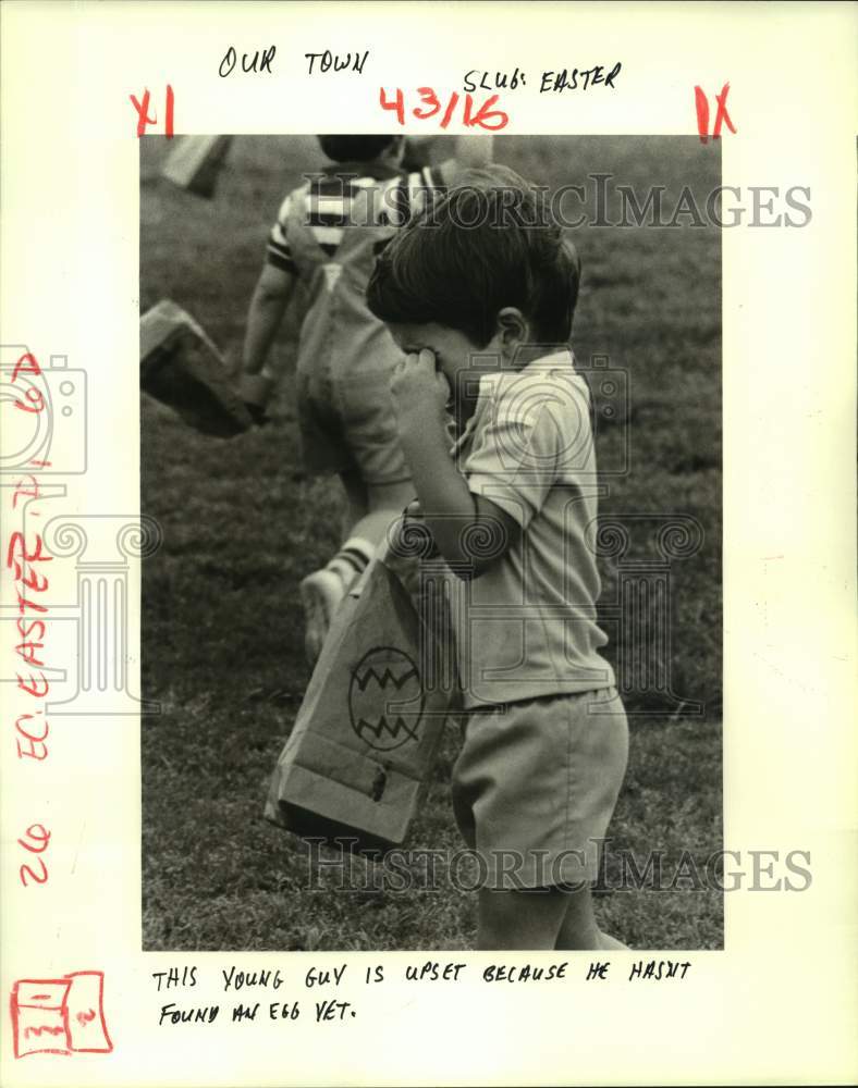 1985 Press Photo Young boy upset for not finding Easter egg at Lafreniere Park- Historic Images