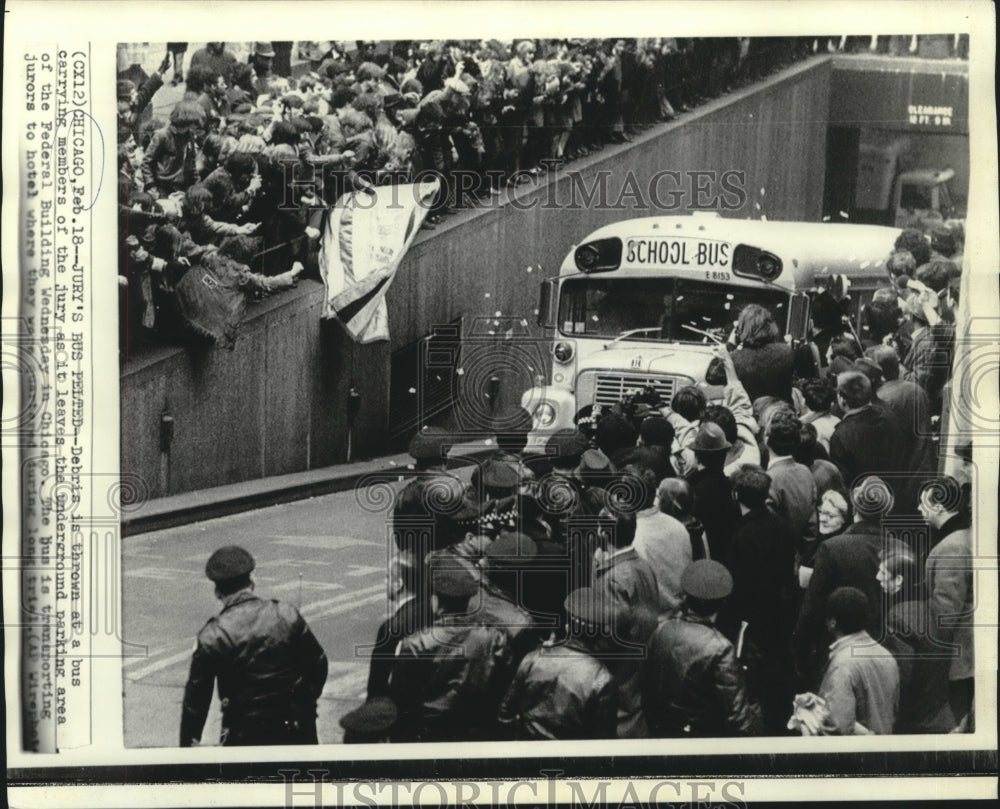 1970 Press Photo Debris thrown at jury bus as it leaves underground parking lot- Historic Images