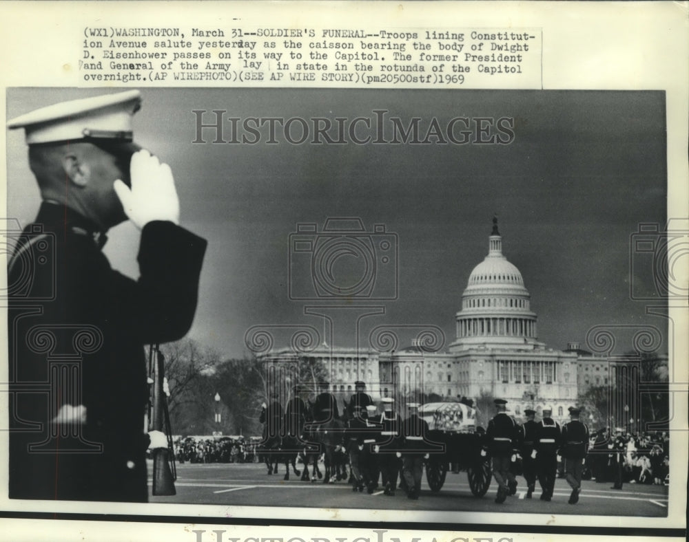 1969 Press Photo Troops salute caisson bearing body of Dwight D. Eisenhower.- Historic Images